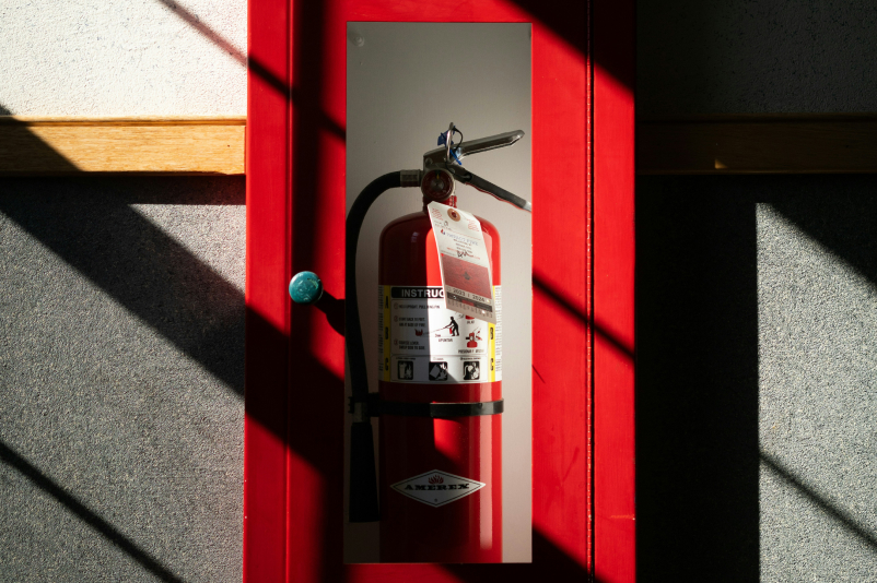 A fire extinguisher shown as part of commercial fire extinguisher services